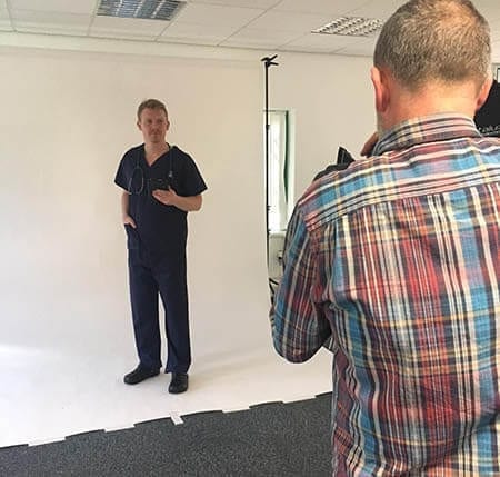 Scrub suit garments being photographed