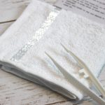 Cold or hot towel set in tray with tweezers